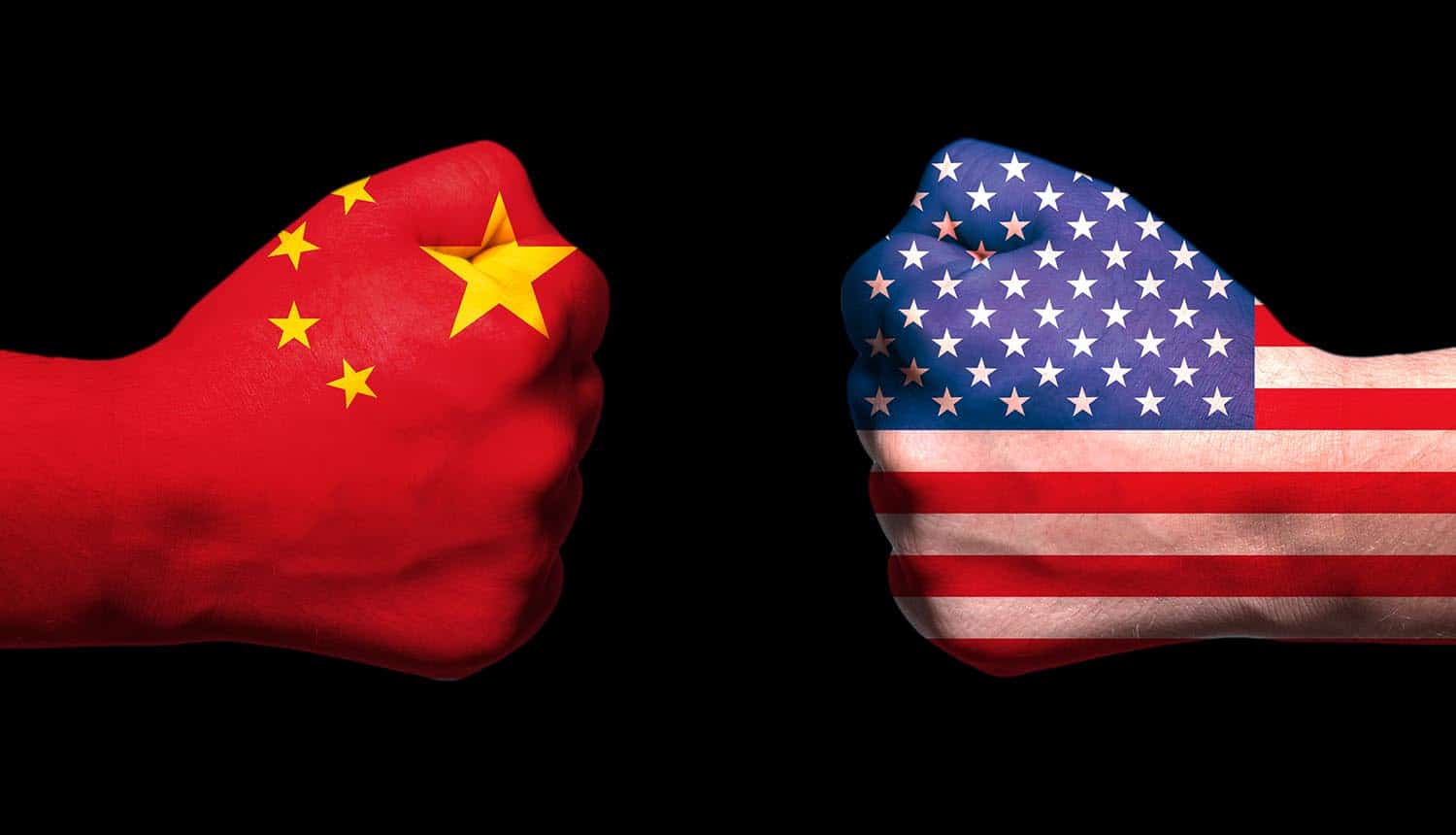 Image showing fist with chinese flag on the left and fist with US flag on the right