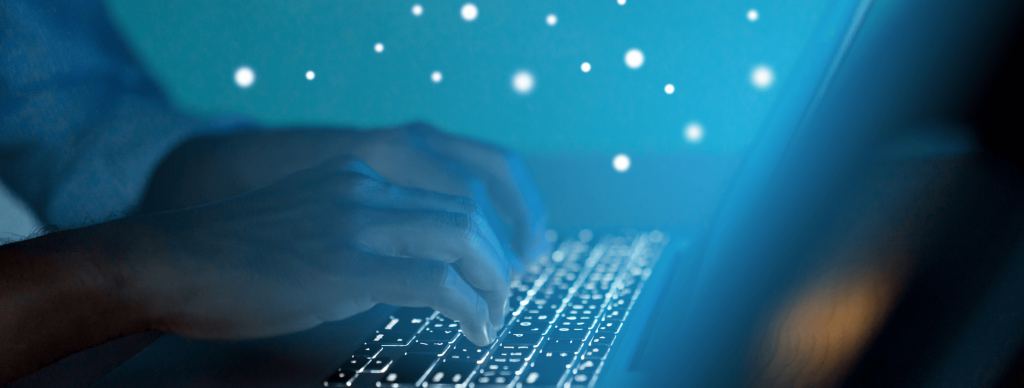 Person typing on keyboard