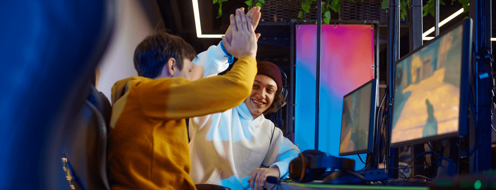 Two gamers exchanging high-fives