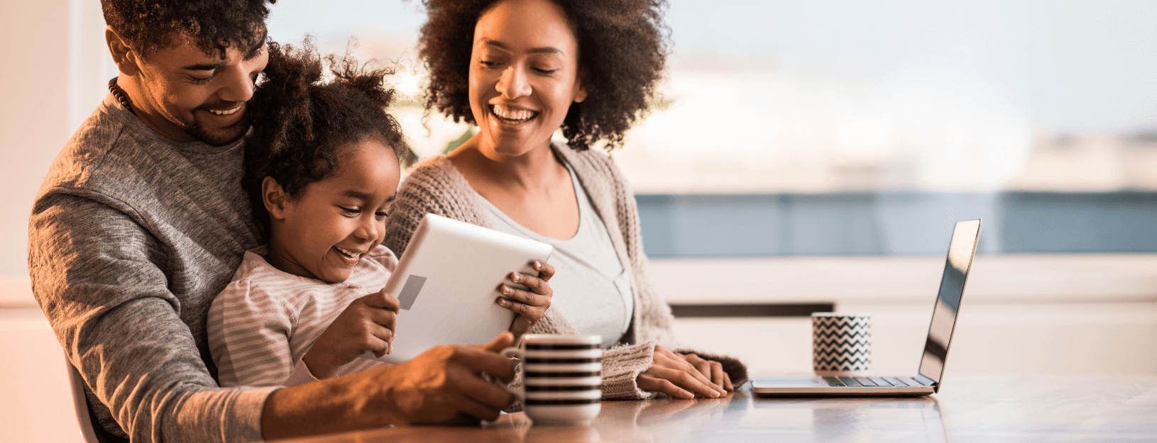 Parents and child using tablet