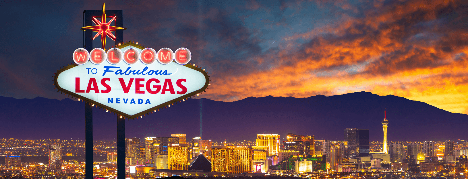 Photo of the Welcome to Las Vegas sign with city in background