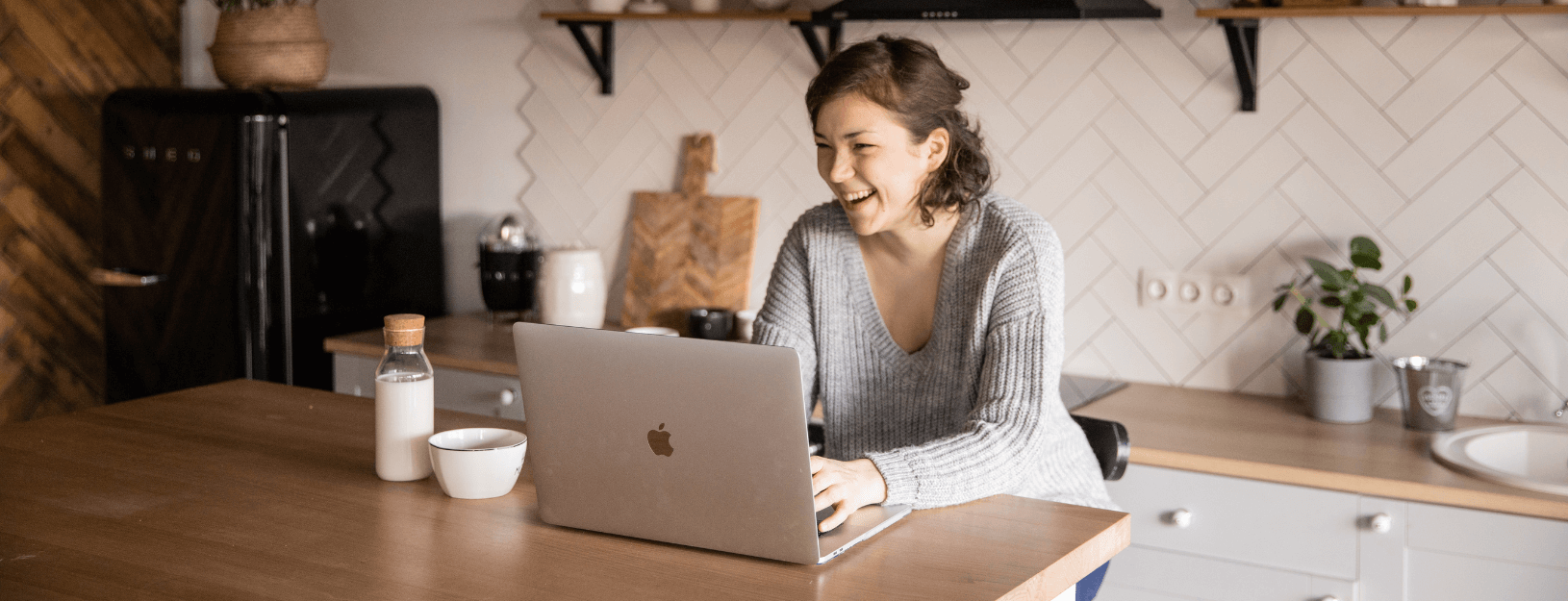 Young student working from home on laptop