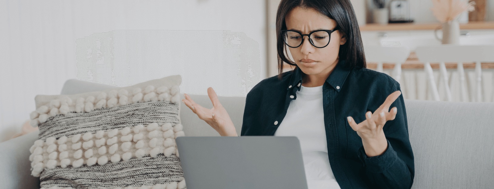 Woman working on laptop in home environment