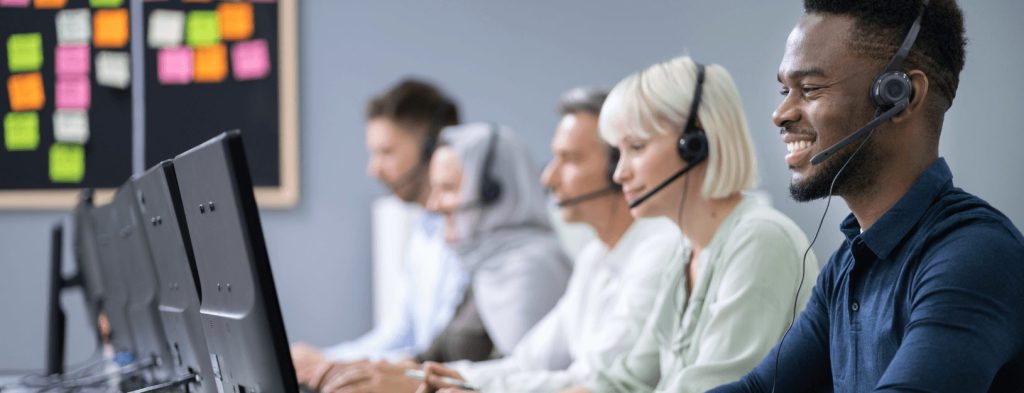 Support team members happily answering calls.
